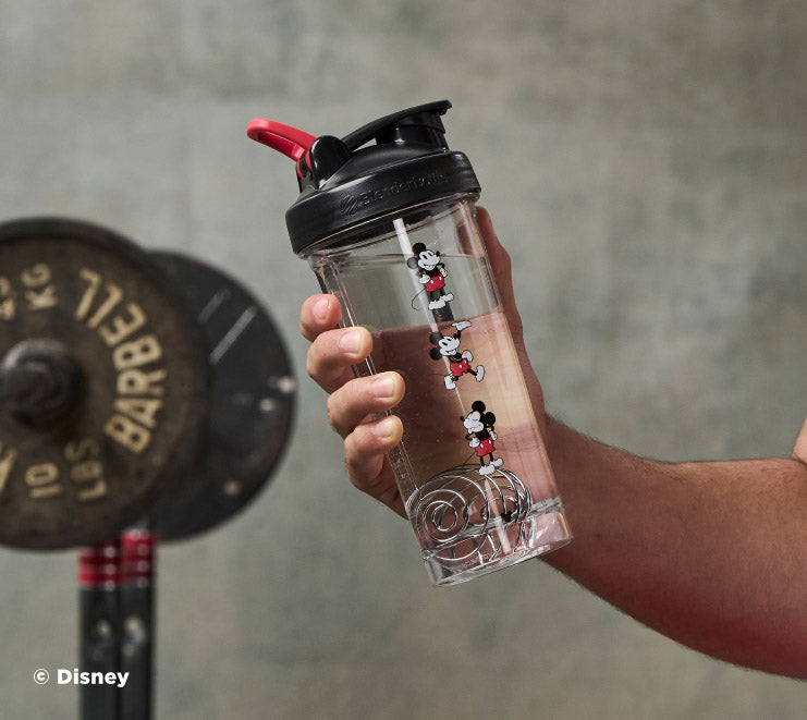pro-series-k3 Mickey_Mouse_Protein_Shaker_Bottle_Being_Held_In_the_Gym.jpg